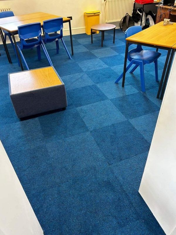 Commercial Carpet tiles in the colour Jazz Blue at a local school. These tiles transform classrooms and hallways into vibrant spaces.